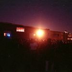 Cat's Head 2, October 6th, 1990, on the Williamsburg waterfront. "Exterior of the warehouse on the night of the event, with the crowd waiting to get in. (The local fire department was wrangling with the organizers over some kind of safety fee)."